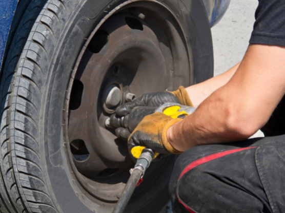 Changing tyre on passenger car|